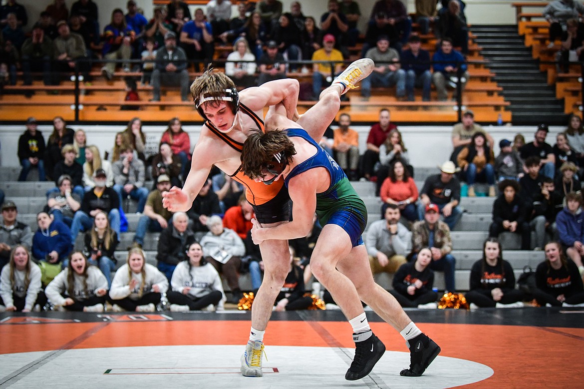 Glacier's Kaleb Shine takes Flathead's Cade Troupe to the mat at 152 pounds during crosstown wrestling at Flathead High School on Thursday, Jan. 19. Shine won by decision 11-4. (Casey Kreider/Daily Inter Lake)