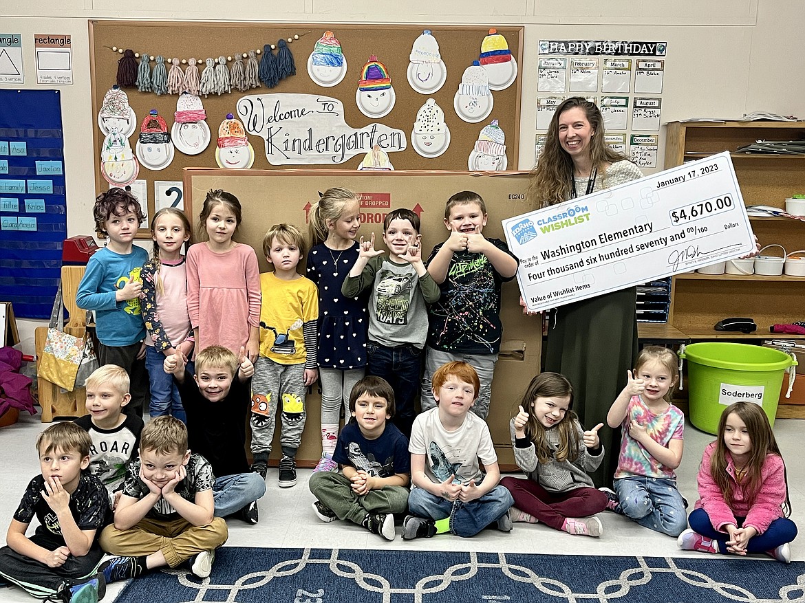Washington Elementary kindergarten students pose for a picture as they join teacher Johanna Soderberg in thanking the Idaho Lottery for a $4,670 Classroom Wishlist grant given to purchase a storage cubby system to hold winter gear and supplies.