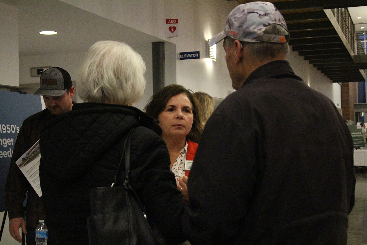 Samaritan Healthcare Chief Executive Officer Theresa Sullivan, center, talks with visitors to the Samaritan open house.