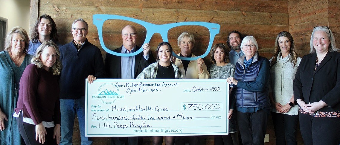 In October, John Morrison (fourth from left) directed a $750,000 gift to Mountain
Health Gives for their Little Peeps program, launching later this year. Here John presents the gift to Mountain Health Gives Executive Director Molly Severtson (far right) and board and staff members of Mountain Health CO-OP, the parent organization of Mountain Health Gives. (Photo courtesy Mountain Health Gives)