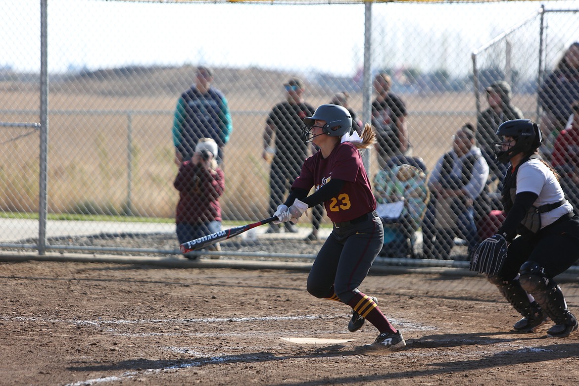 Katelyn Kriete, who signed to play collegiately for the Community Colleges of Spokane on Thursday, looks on after hitting a ball during slowpitch district playoffs in October.