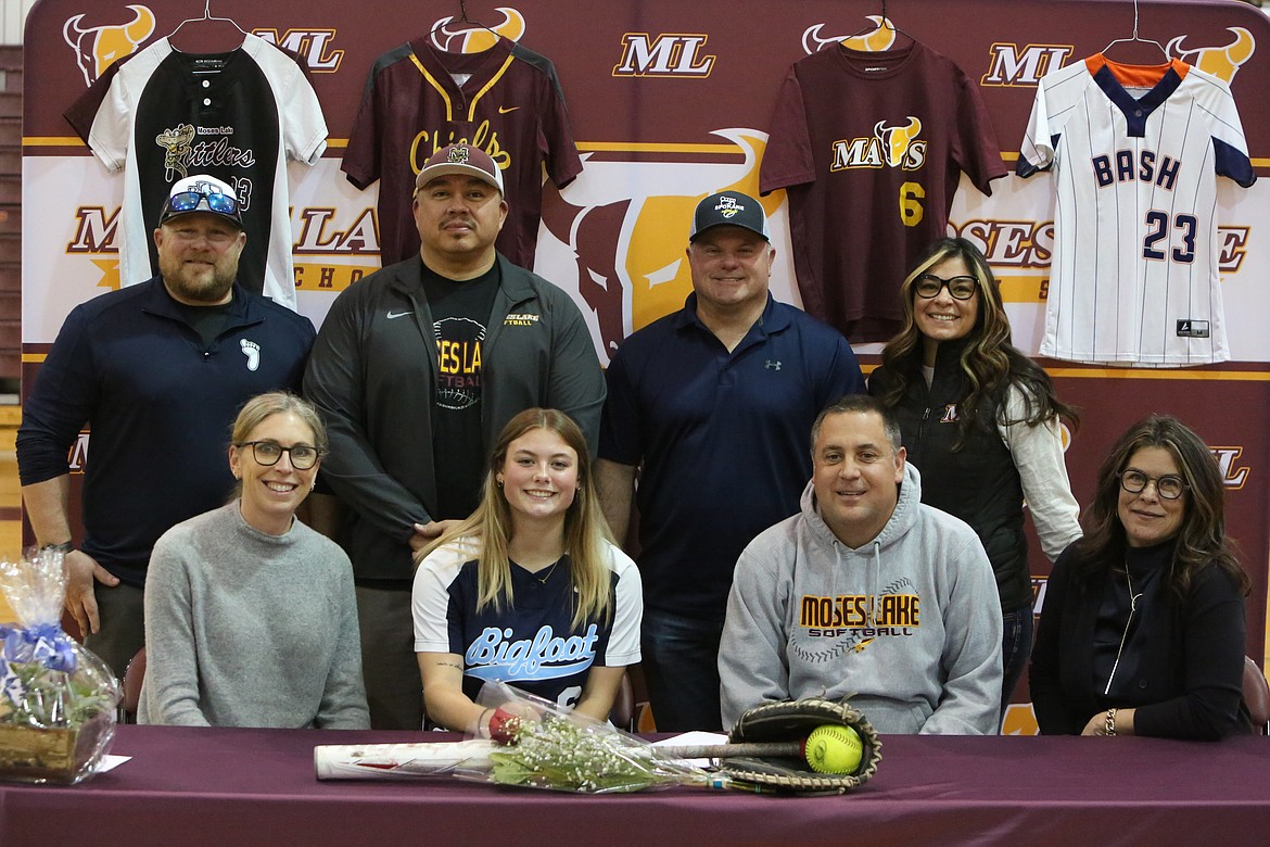 Former, current and future coaches pose for photos at Katelyn Kriete’s collegiate signing on Thursday.