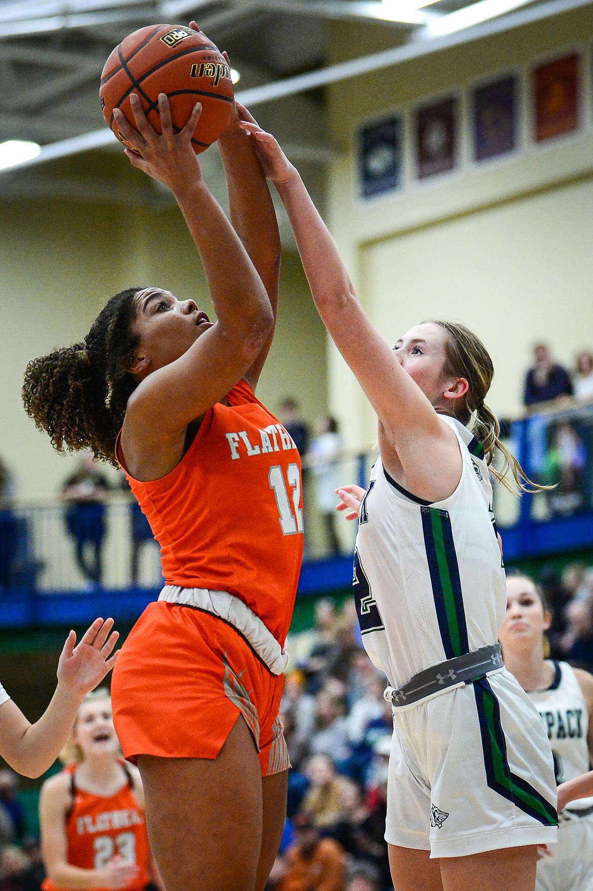 Flathead's Akilah Kubi (12) looks to shoot with Glacier's Sarah Downs (2) defending in the second half during crosstown basketball at Glacier High School on Friday, Jan. 20. (Casey Kreider/Daily Inter Lake)