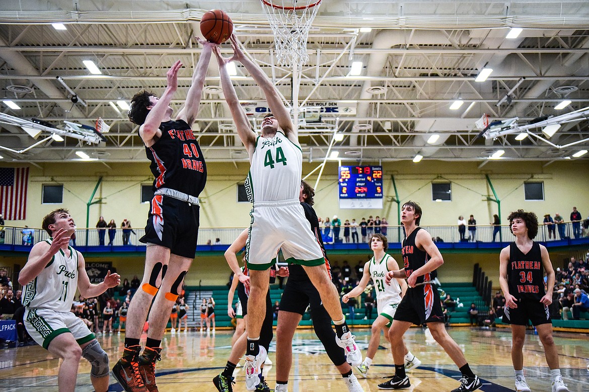 Flathead's Noah Cummings (40) and Glacier's Noah Dowler (44) battle for a rebound during crosstown basketball at Glacier High School on Friday, Jan. 20. (Casey Kreider/Daily Inter Lake)