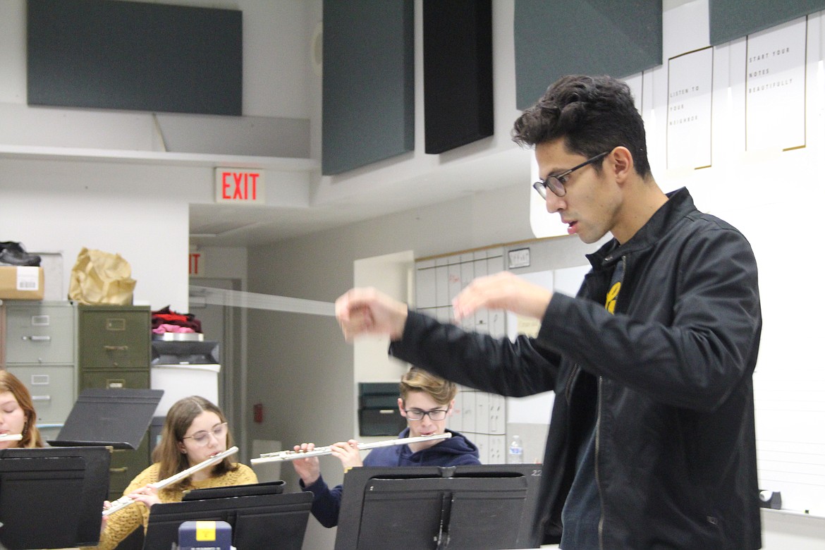 Moses Lake High School music instructor Pablo Hernandez gives the downbeat.