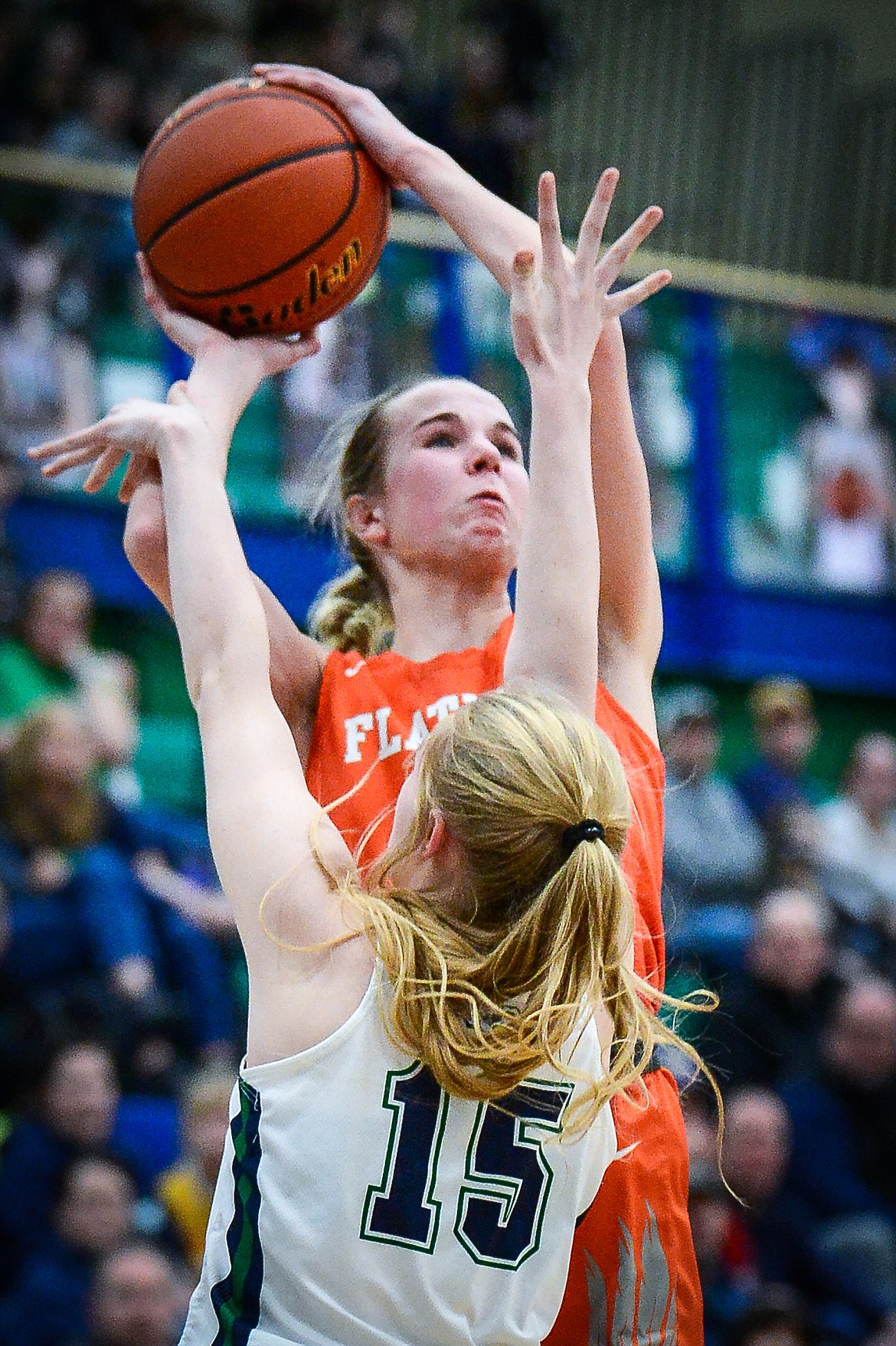 Flathead's Kennedy Moore (14) sinks a jumper over the defense of Glacier's Charlotte Osler (15) in the fourth quarter during crosstown basketball at Glacier High School on Friday, Jan. 20. (Casey Kreider/Daily Inter Lake)