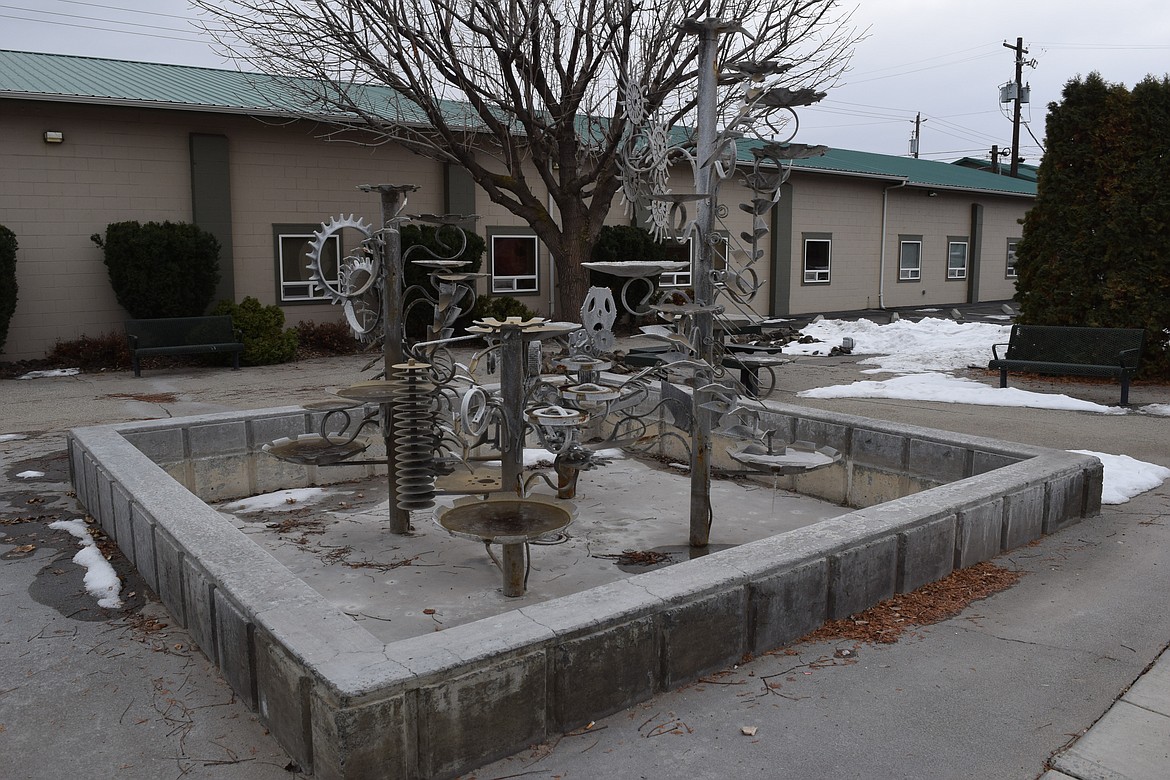 The fountain at Quincy Rotary Plaza sits dormant with ice and bits of snow scattered about in its basin. According to a nearby plaque, the tribute to the areas agricultural heritage was built by Quincy resident Scott Lybbert to pay tribute to the connection between farming and irrigation that transformed Quincy – and the Columbia Basin in general – into an agricultural center. In warmer weather, water flows through bits of farm implements and keeps the surrounding plaza a pleasant place to visit.