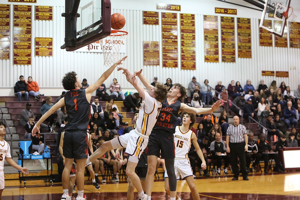 Moses Lake senior guard Blaine Macdonald fights through contact to score a basket against Davis in the second quarter of the Mavericks’ 81-59 loss to Davis on Friday.