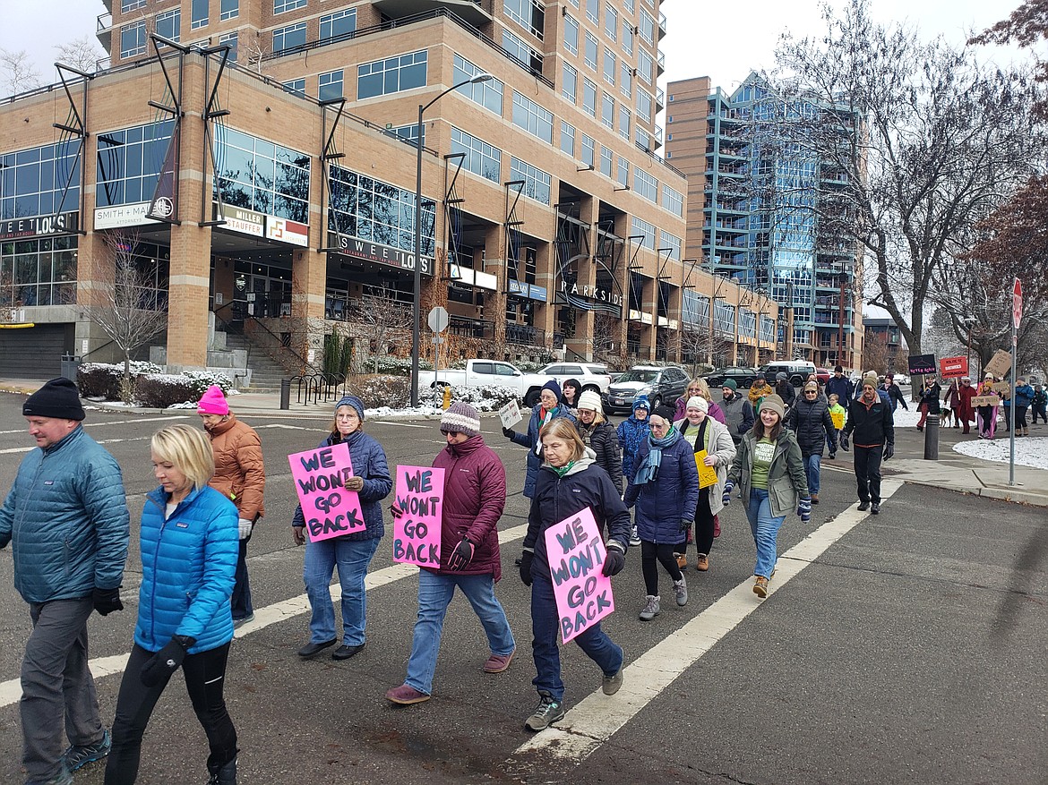 Supporters of Roe v. Wade walk from the Coeur d'Alene Public Library toward Sherman Avenue, shouting, “They say no choice, we say pro-choice,” to celebrate the 50th anniversary of the U.S. Supreme Court decision.