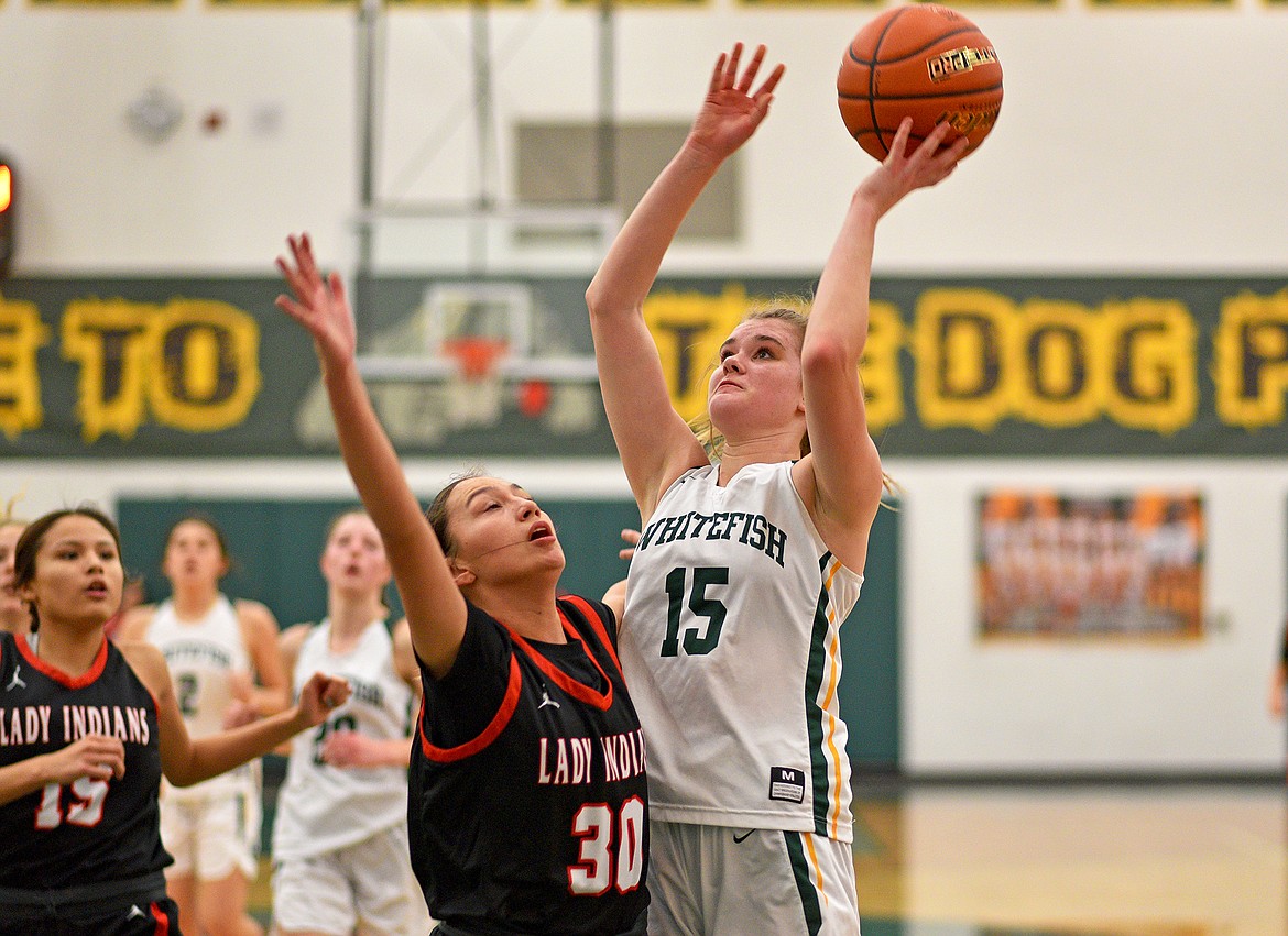 Whitefish's Bailey Smith shoots over the Browning defense on Saturday in Whitefish. (Whitney England/Whitefish Pilot)