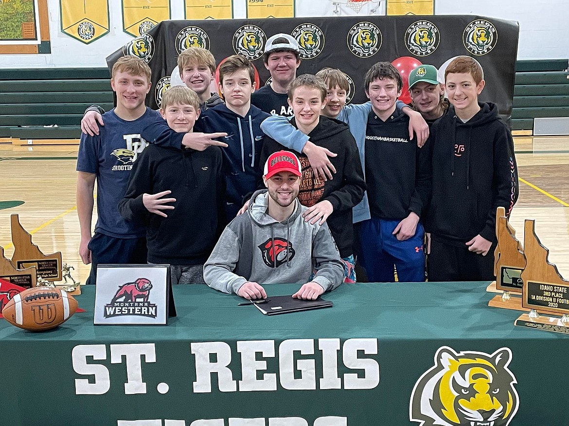 St. Regis senior Caleb Ball signs to play football with Montana Western at a signing day event in St. Regis. (Photo provided)