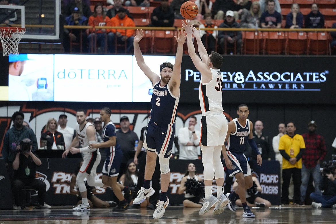 Pacific guard Judson Martindale (33) shoots a 3-point basket over Gonzaga forward Drew Timme (2) during the first half of an NCAA college basketball game in Stockton, Calif., Saturday, Jan. 21, 2023.