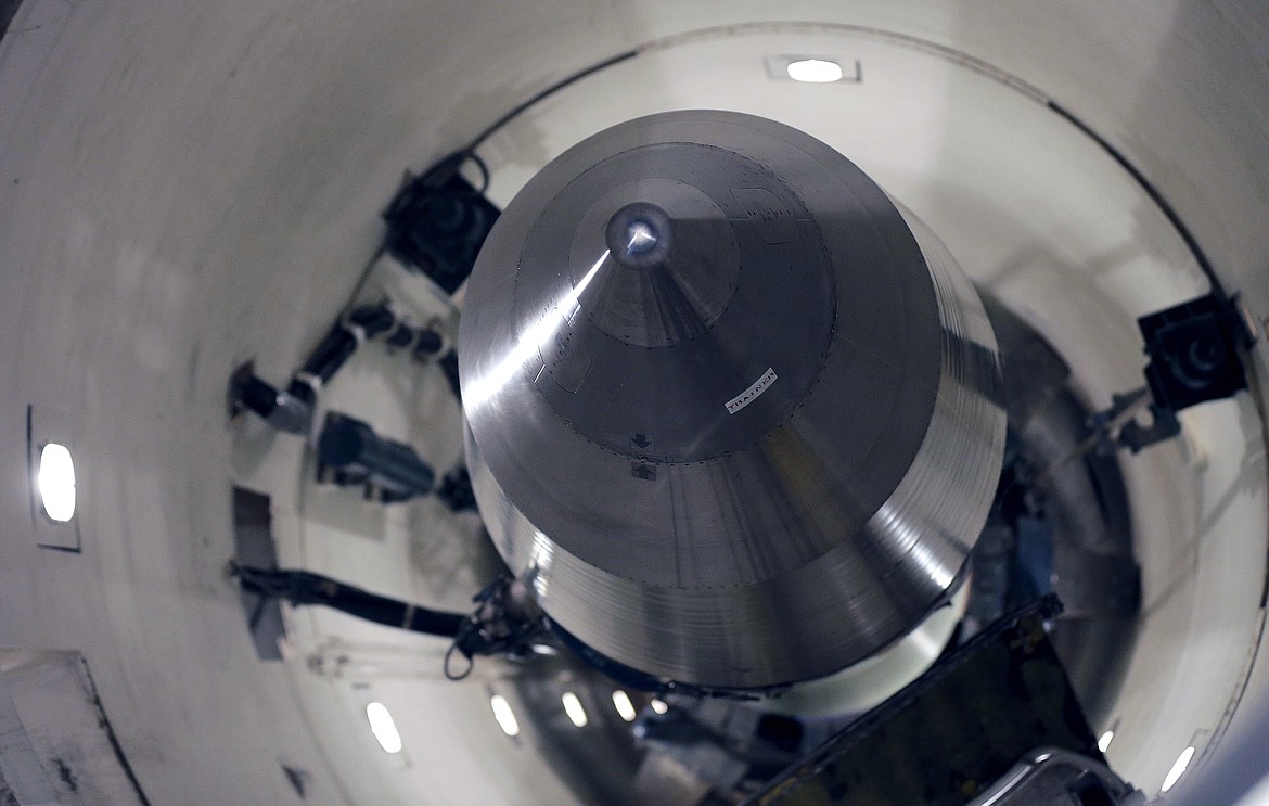 An inert Minuteman III missile is seen in a training launch tube at Minot Air Force Base, N.D., June 25, 2014. Nine military officers who had worked decades ago at a nuclear missile base in Montana, home to a vast field of 150 Minuteman III intercontinental ballistic missile silos, have been diagnosed with blood cancer and there are “indications” the disease may be linked to their service, according to military briefing slides obtained by The Associated Press. One of the officers has died. (AP Photo/Charlie Riedel, File)