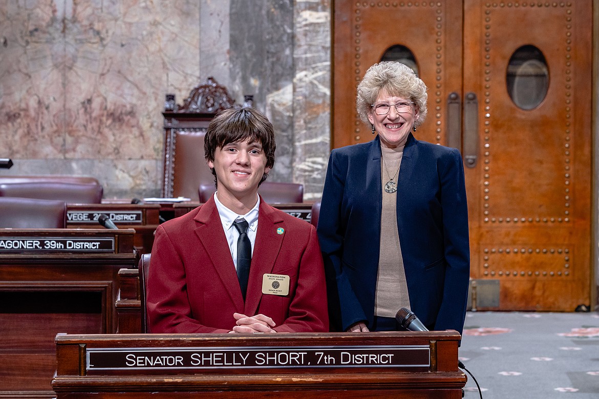 Noah Hunt, 16, of Coulee Dam poses with Sen. Shelly Short (R-Addy) on the Senate floor.