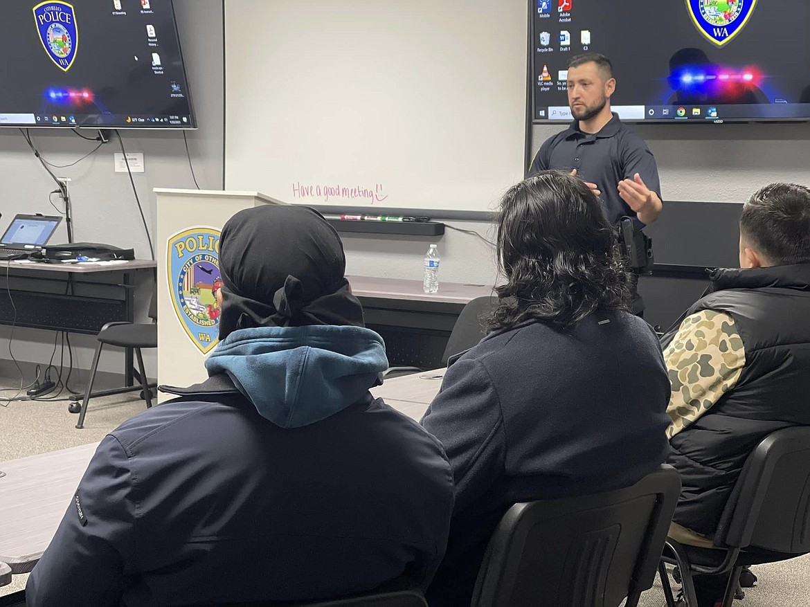 Officer Xavier Garza, one of Othello PD’s newest recruits talks to attendees at a seminar on law enforcement on Friday. The seminars being conducted by OPD not only help with recruitment but are a great tool to connect with the community, OPD Chief Phil Schenck said.