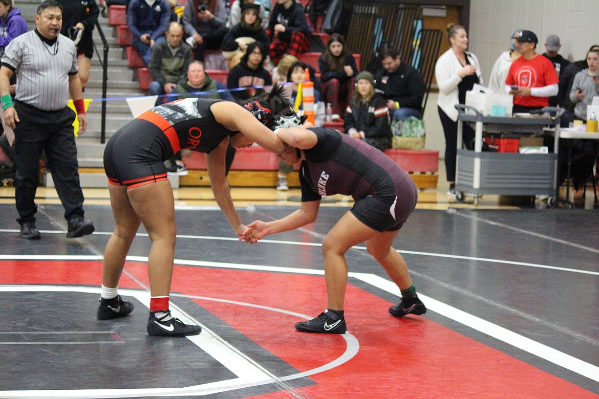 Wahluke’s Citali Ramos, right, grapples with Heaven Samuels of Orting during Saturday’s Lady Huskie Invitational in Othello.