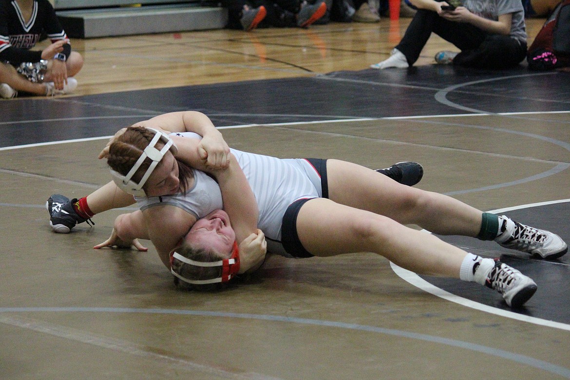 Diamond Van Cleve (top) almost but not quite pinned her opponent, Chloe Cahan of Snohomish. Cahan came back to win the match during the Lady Huskie Invitational.