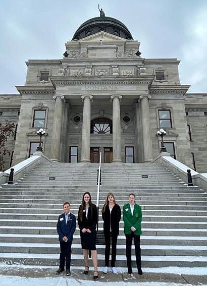 John McNamara, Hannah Warnes, Melodie Cook and Mikiah Cook at the Montana Capitol in Helena.