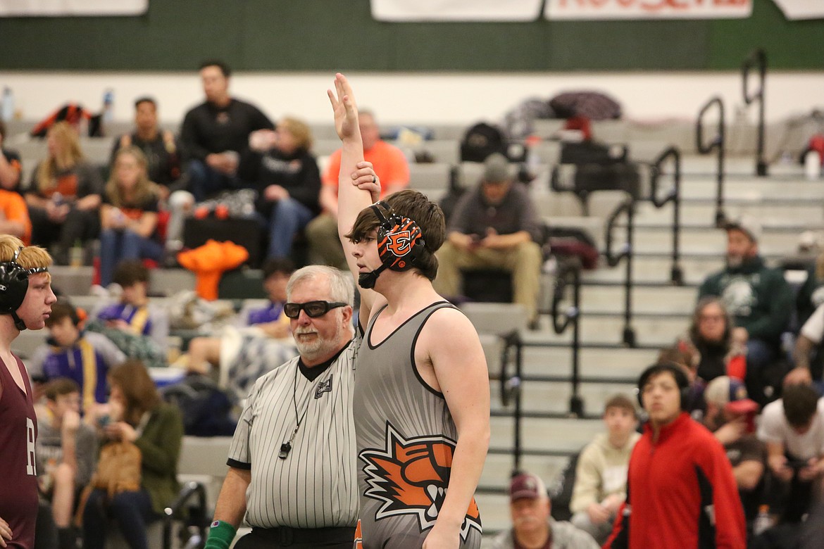 Ephrata freshman Micah Sandberg, right, has his arm raised after defeating a Reardan wrestler.