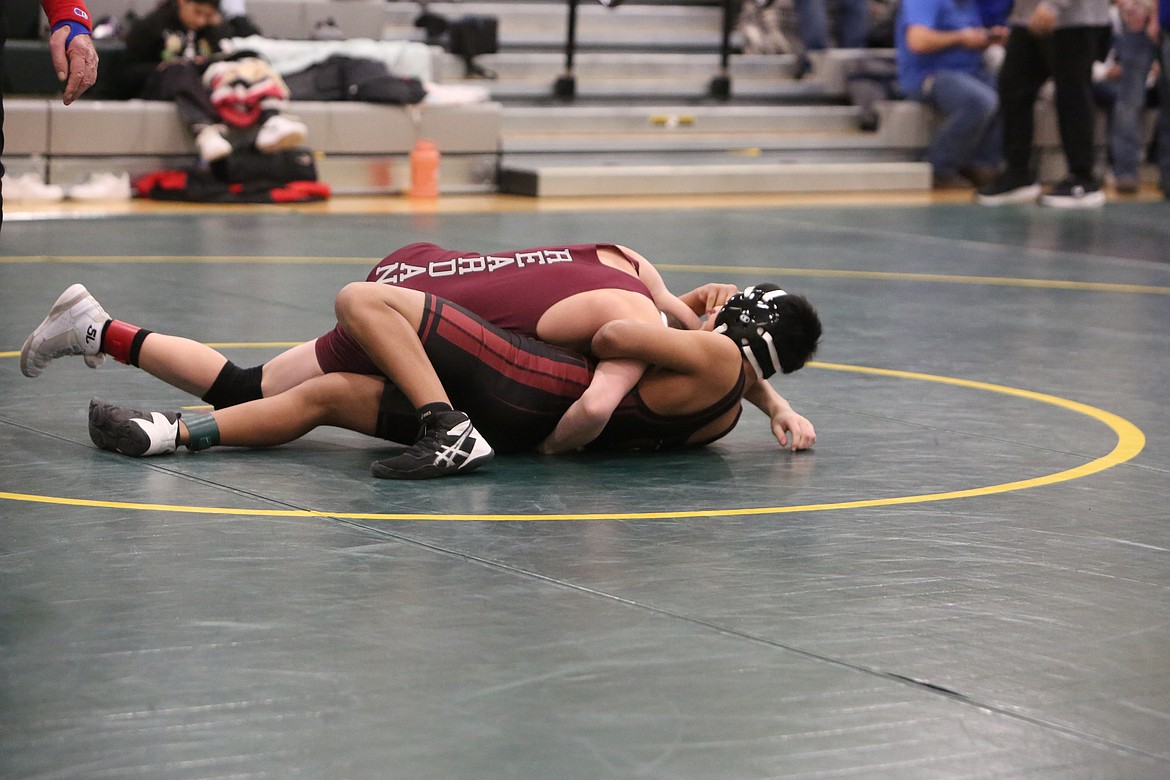 Wahluke sophomore Victor Mateo, bottom, wrestles his way out of the grip of his Reardan opponent.