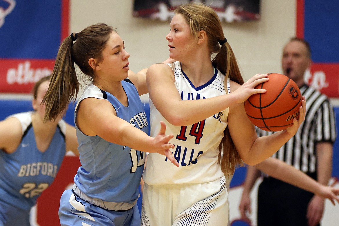 Bigfork's Maddie Chappuis plays tight defense on Columbia Falls guard Hope McAtee in Tuesday's matchup in Columbia Falls. (Jeremy Weber/Daily Inter Lake)