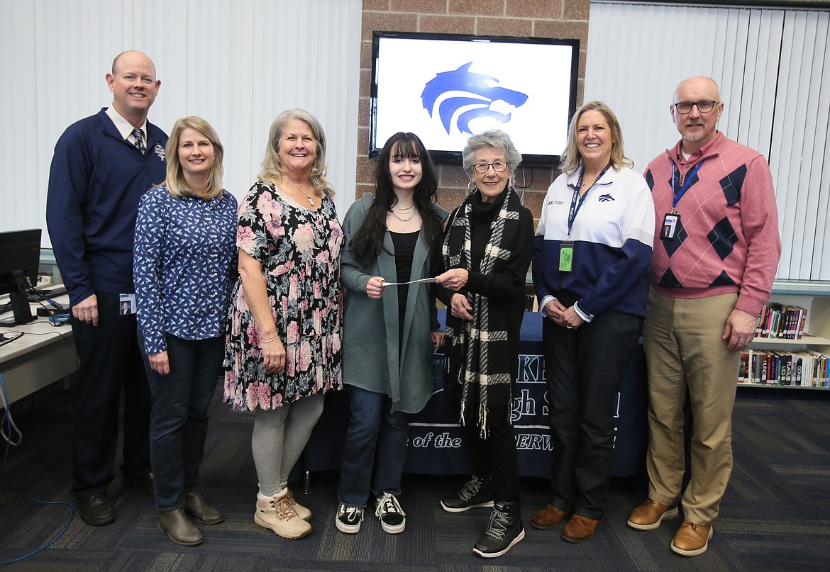 A small ceremony was held Monday to celebrate Lake City High senior and honors art student Jos Benak, who received a $500 Jack Bannon Memorial Scholarship to continue her work in the arts. From left: Coeur d'Alene Superintendent Shon Hocker, art teacher Cynthia Chapman, Coeur d'Alene Arts and Culture Alliance Executive Director Ali Shute, Jos, Jack Bannon Memorial Scholarship founder and actress Ellen Travolta, LCHS Principal Deanne Clifford and Assistant Superintendent Trent Derrick.