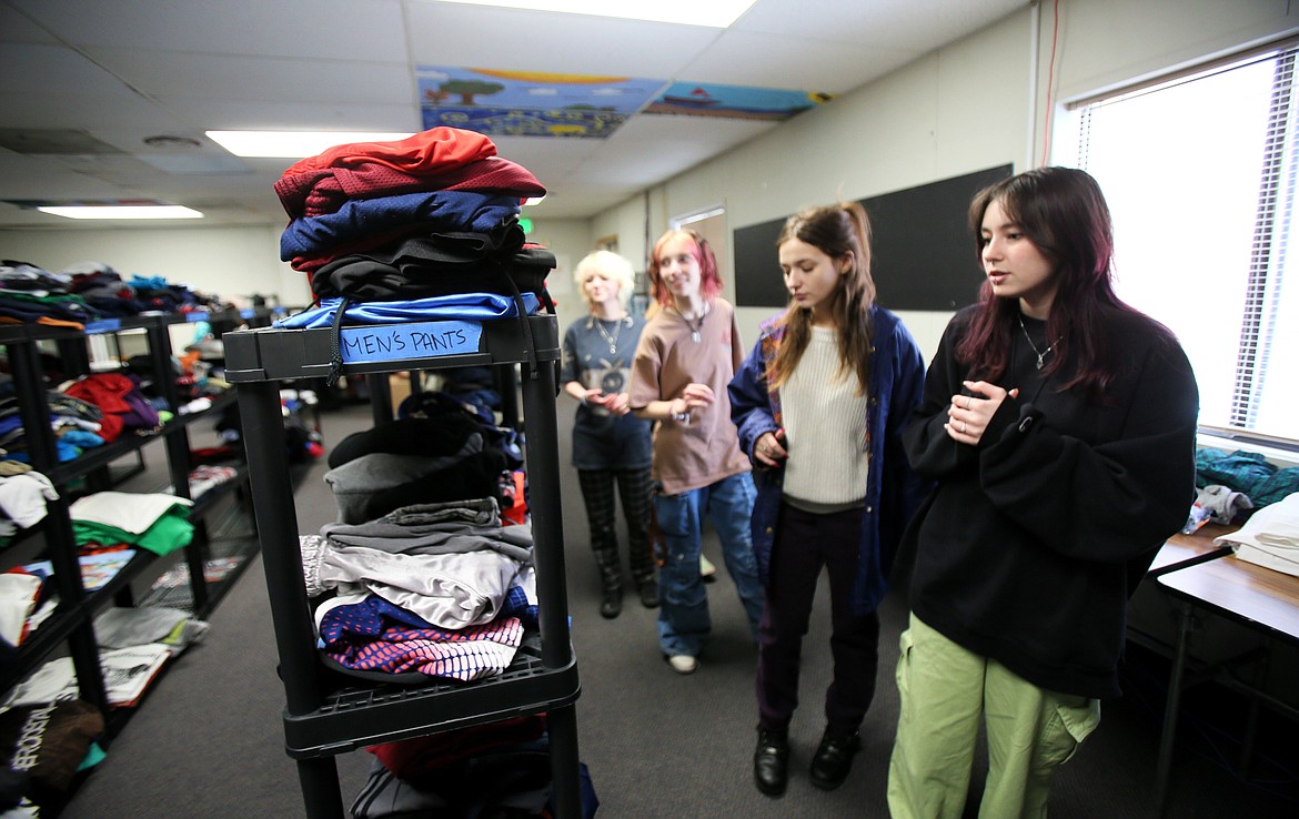 Students show off the new Community Clothes Closet during a tour Jan. 24 at New Vision Alternative High School. From left: Matte Wood, Aryanna Kirsebom, Echoe Stapel and Lilly Glasser.