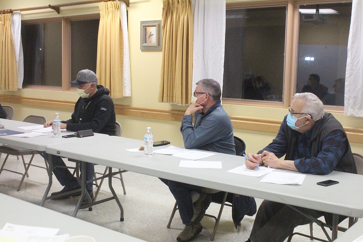 From left, Quincy Valley Medical Center commissioners Anthony Gonzalez, Randy Zolman and Bob Poindexter listen to an update on planning for the new hospital.