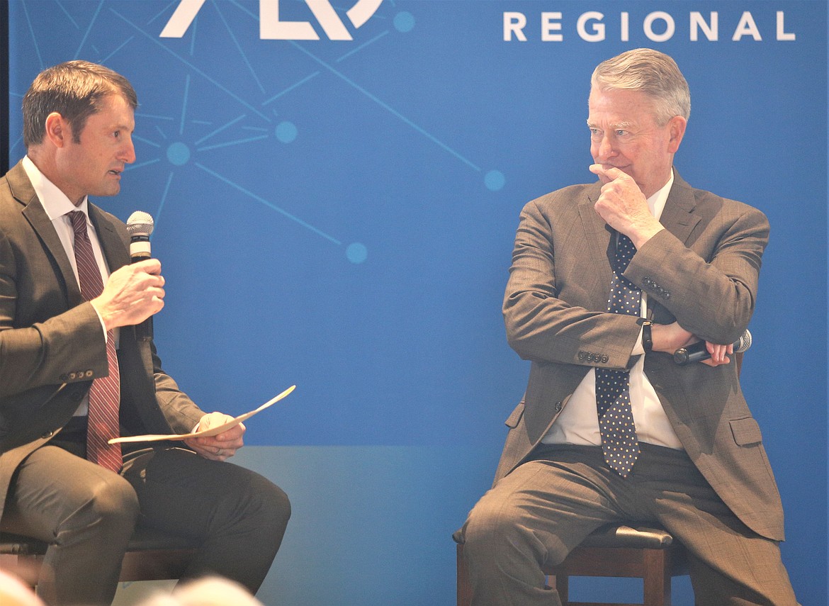 Gov. Brad Little, right, listens to Tyrel Stevenson ask a question   at the Hagadone Event Center on Tuesday.