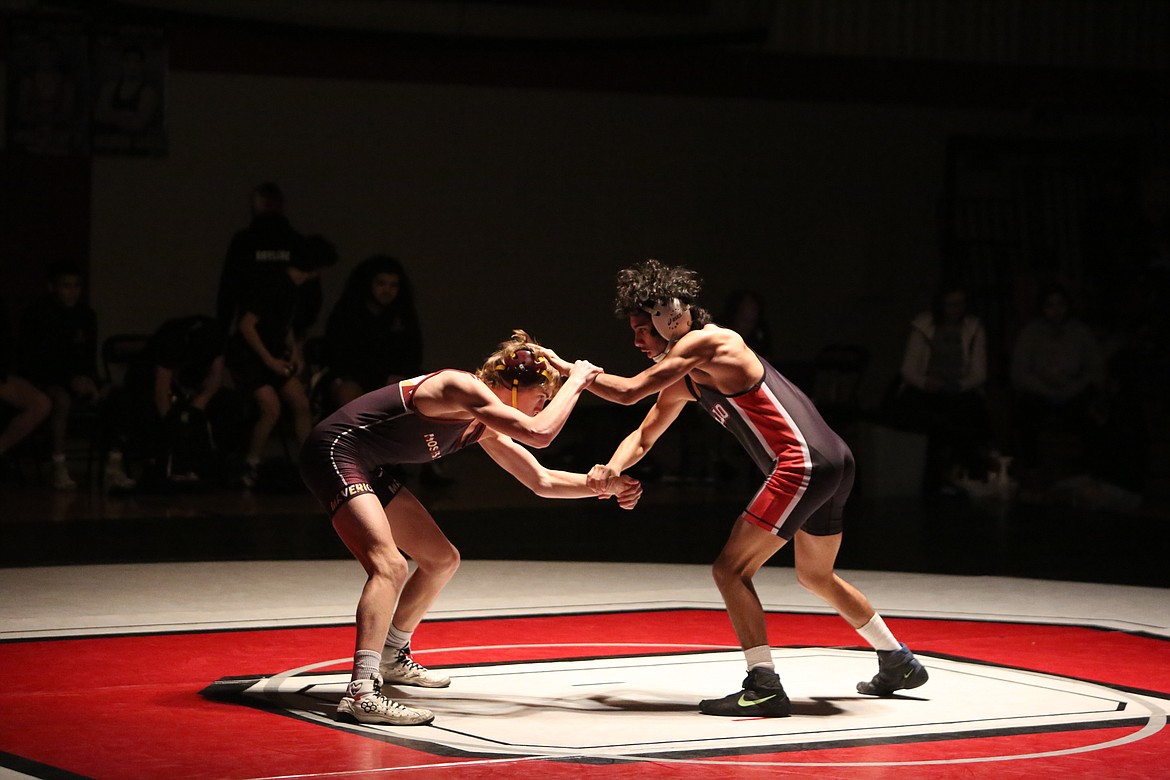 Othello’s Adriel Flores, right, wrestles against Moses Lake’s Ian Anderson at a dual meet on Jan. 17. Both wrestlers placed in the 132-pound weight class at the Rumble in the Valley tournament over the weekend, with Anderson placing third and Flores placing fourth.