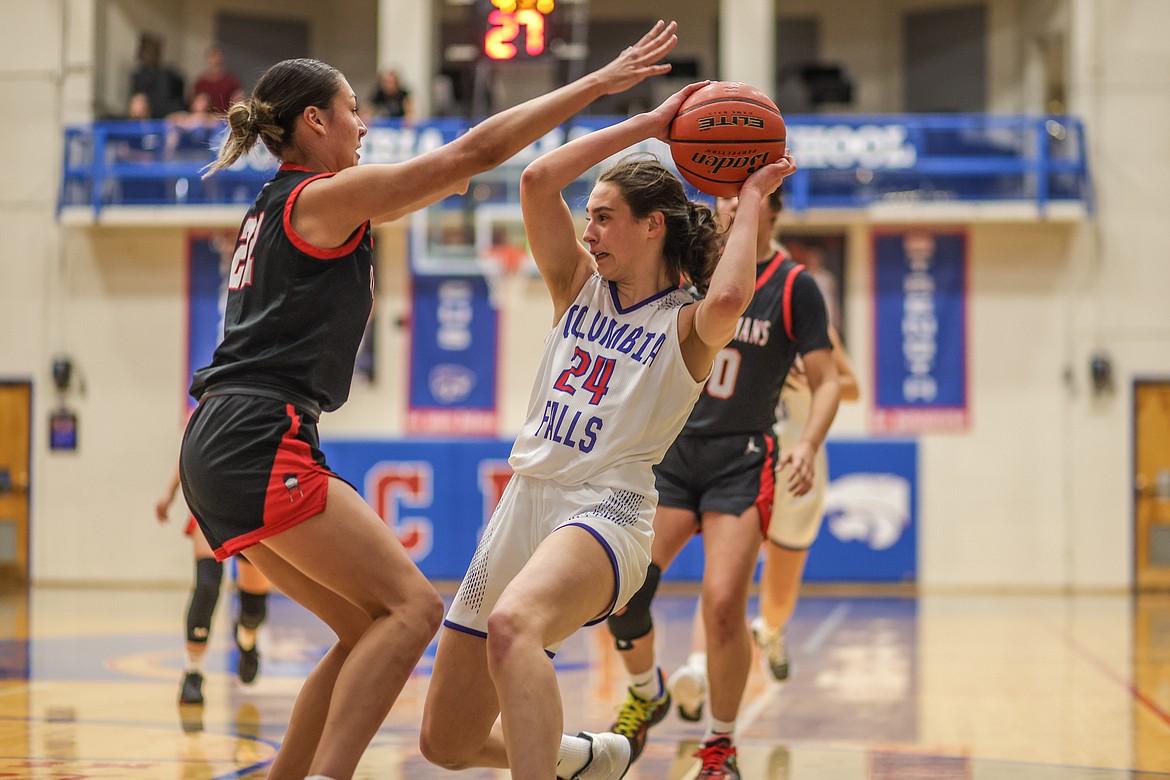 Junior Lexi Oberholtzer looks to pass at home on Friday against Browning. (JP Edge photo)