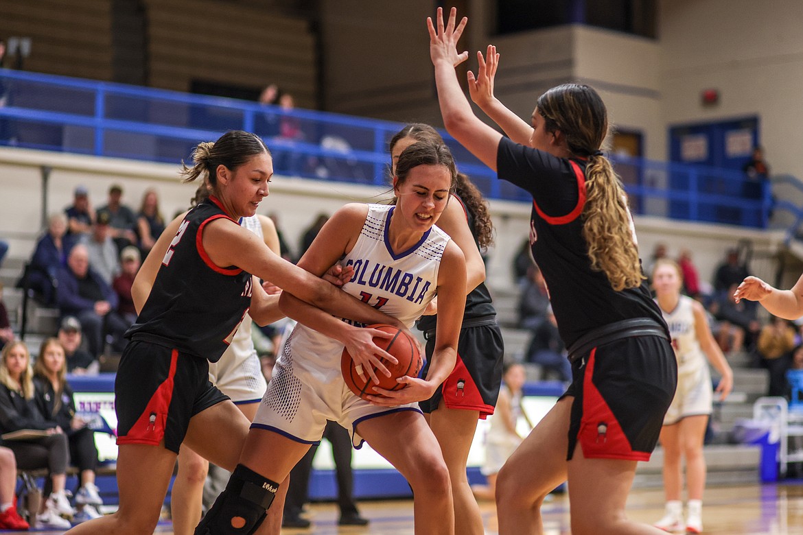 Senior Kia West fights to keep control of the ball against Browning at home on Friday. (JP Edge photo)