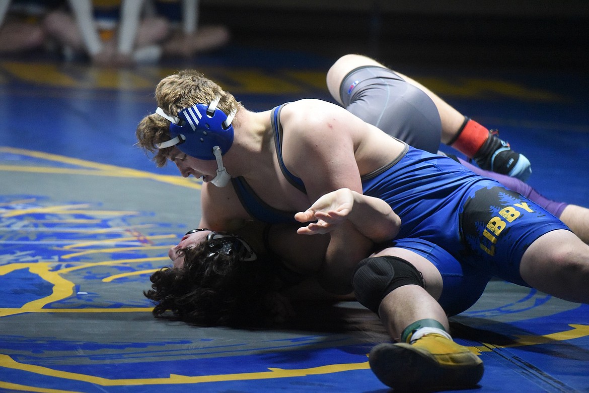 Libby's Matthew Niemi pinned Polson's Kirin Doty at 182 pounds during Tuesday's match. (Scott Shindledecker/The Western News)