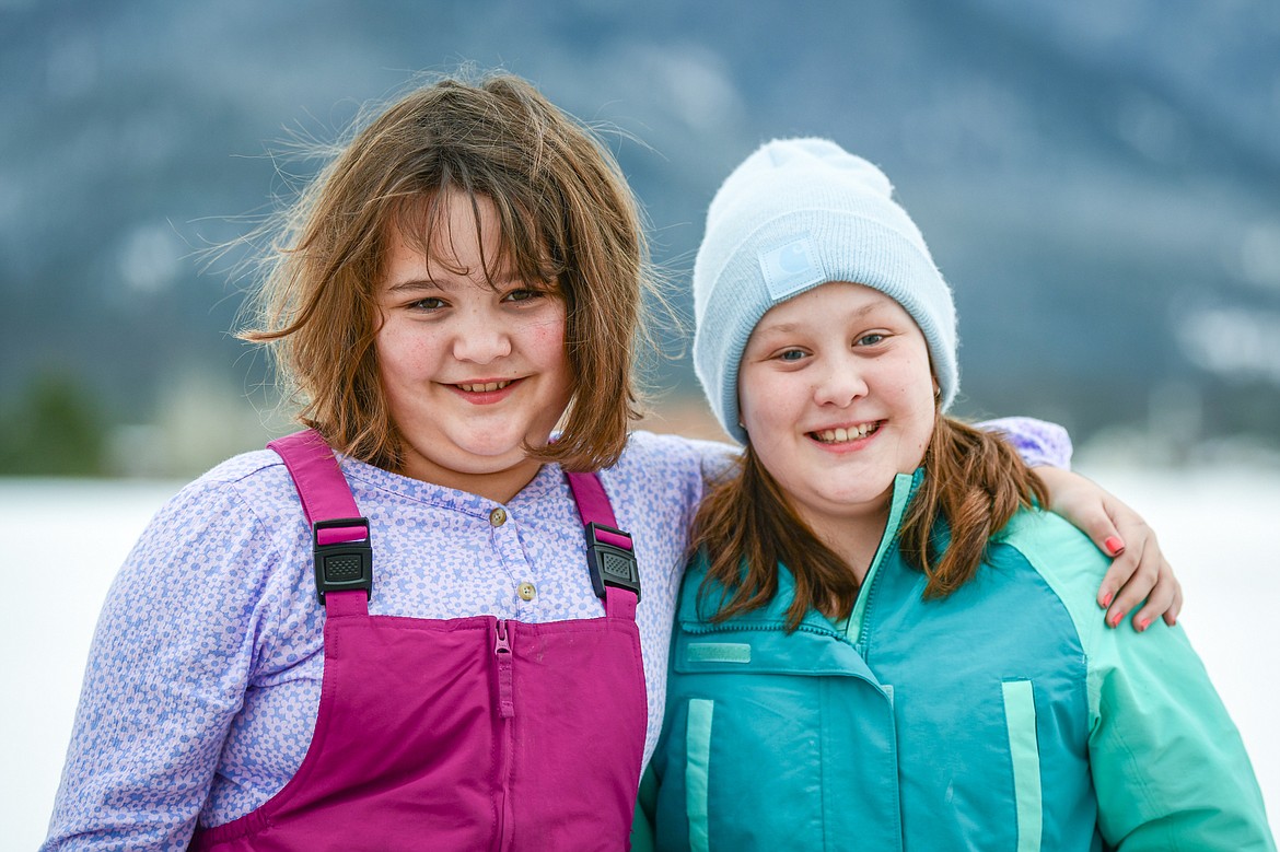 Fourth-grade twins Quora and Teaghan Roe, one of eight sets of twins enrolled at Cayuse Prairie School on Tuesday, Jan. 24. (Casey Kreider/Daily Inter Lake)