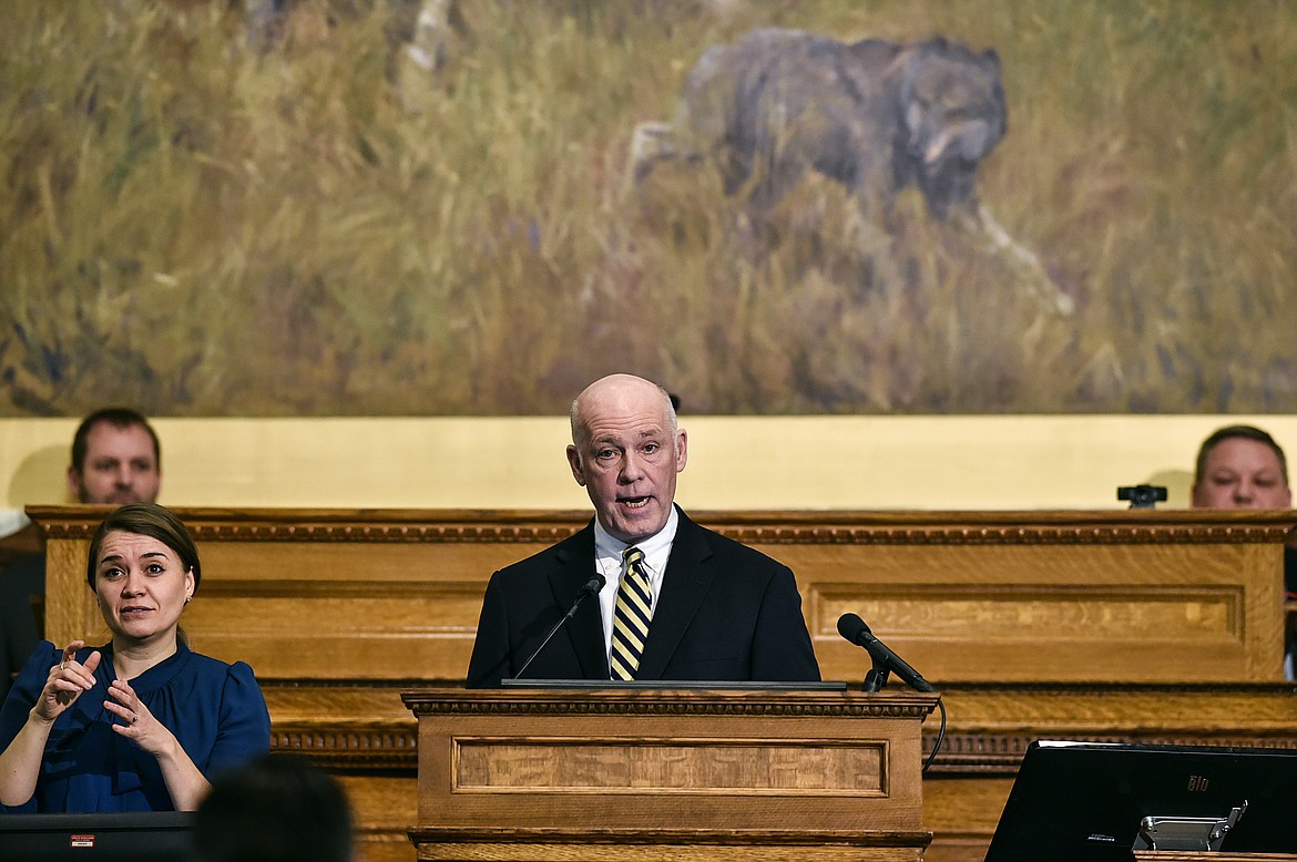 Gov. Greg Gianforte, center, delivers his State of the State address to a joint session of the Montana Senate and House of Representatives on Wednesday, Jan. 25, 2023, in the Montana State Capitol, in Helena, Mont. (Thom Bridge/Independent Record via AP)