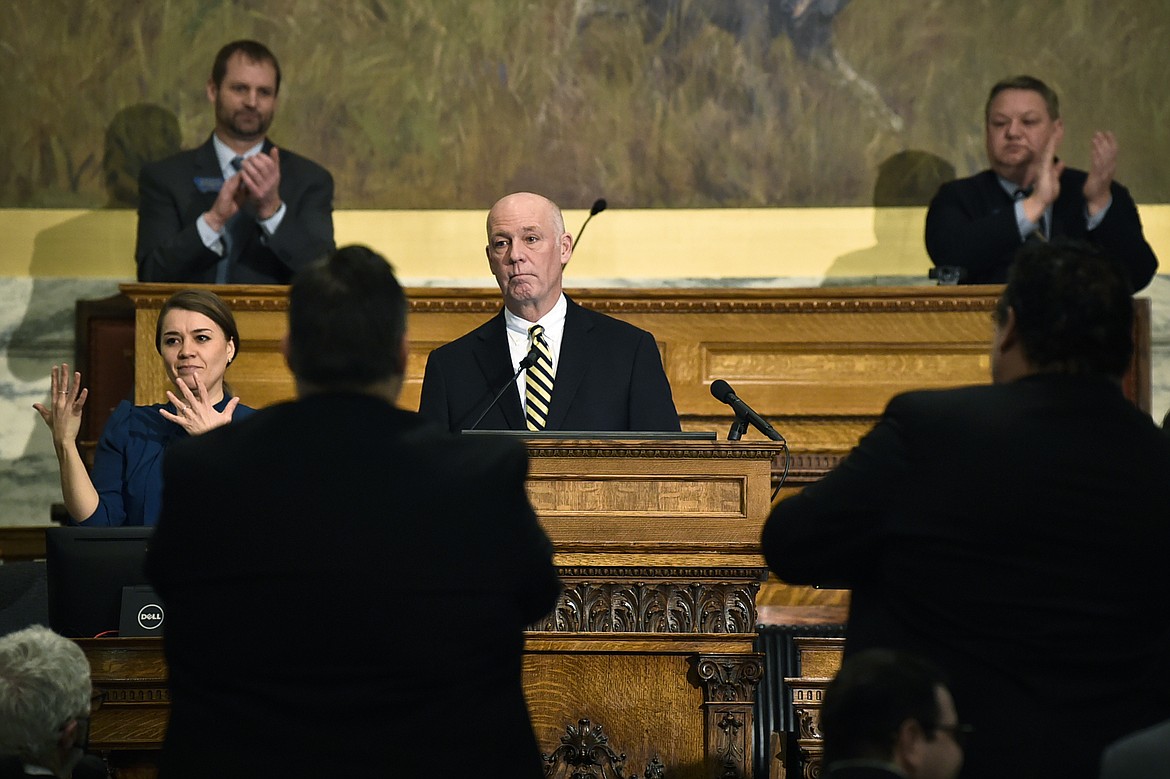 Gov. Greg Gianforte, center, delivers his State of the State address to a joint session of the Montana Senate and House of Representatives on Wednesday, Jan. 25, 2023, in the Montana State Capitol, in Helena, Mont. (Thom Bridge/Independent Record via AP)