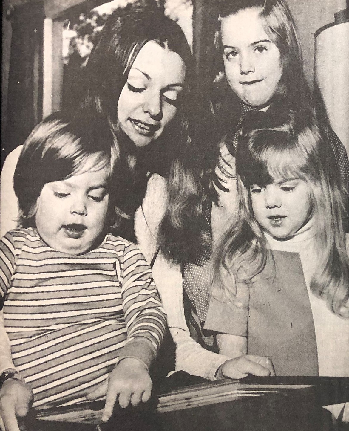 In January 1973, Judy McMurray is shown with three children: Lisa, 6, Christine, 3, and John, 2.