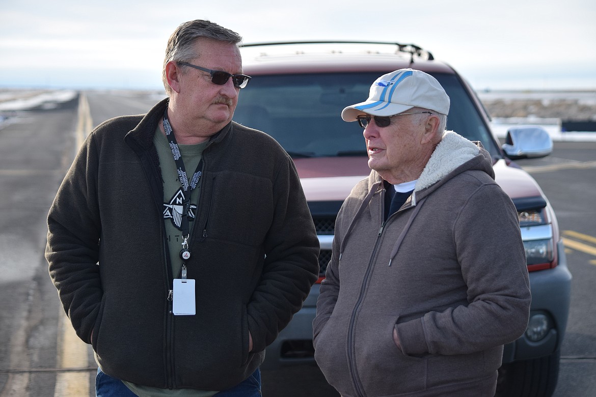 Port of Moses Lake Commission Darrin Jackson, left, and former Port Executive Director David Bailey, standing out on the airfield at the Grant County International Airport on Tuesday as they wait for the last 747 built by Boeing to briefly touch down before being delivered to Atlas Air. Before coming to work for the port in 1972, Bailey worked as an engineer with Boeing on the 747, and saw the first plane touch down in Moses Lake as part of the company’s testing program.
