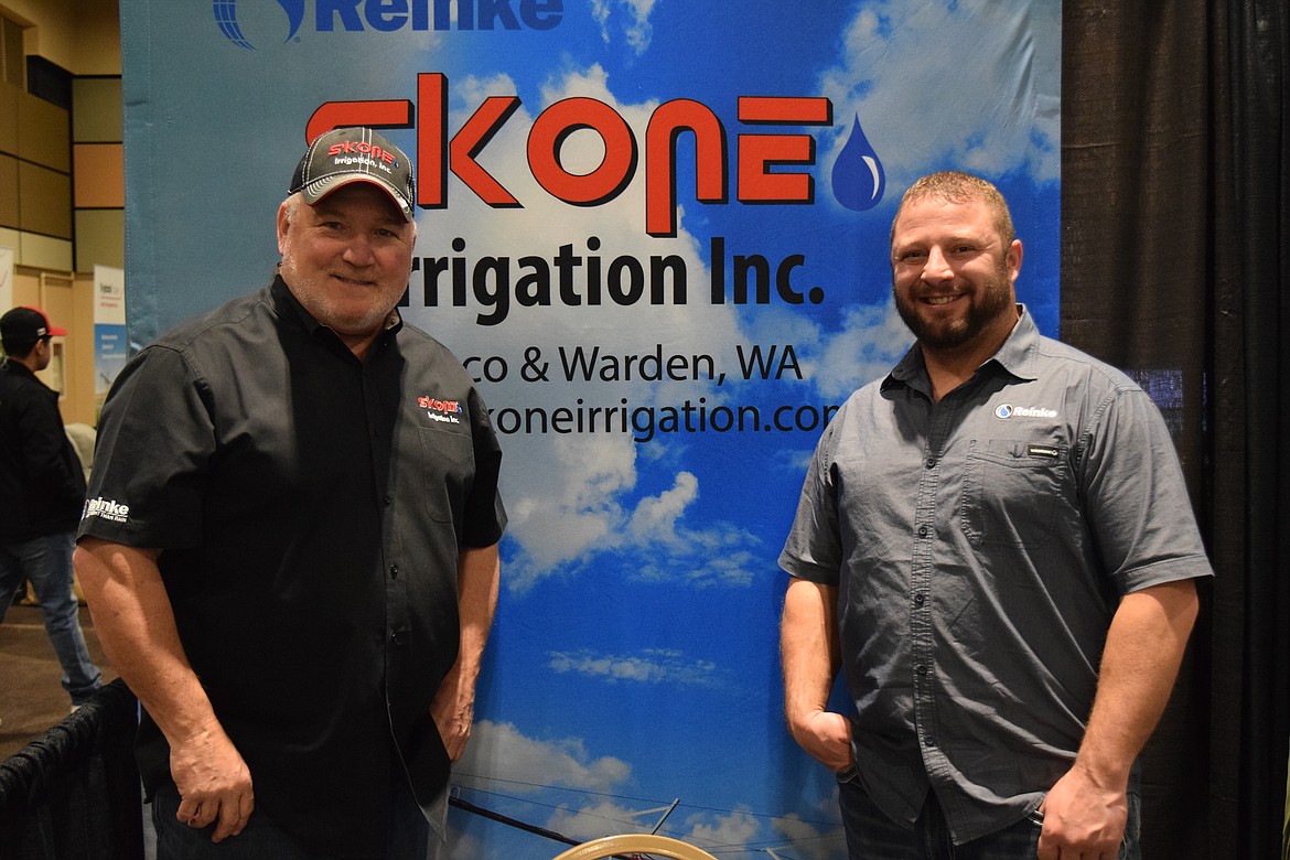 Lary Remsberg, store manager for Skone Irrigation in Pasco, and Even Tortel, the northwest territory manager for irrigation pivot maker Reinke, at this year’s Washington-Oregon Potato Conference. Reinke named Skone one of its top-ten retailers for 2022. “These guys are the champions,” Tortel said of Skone.