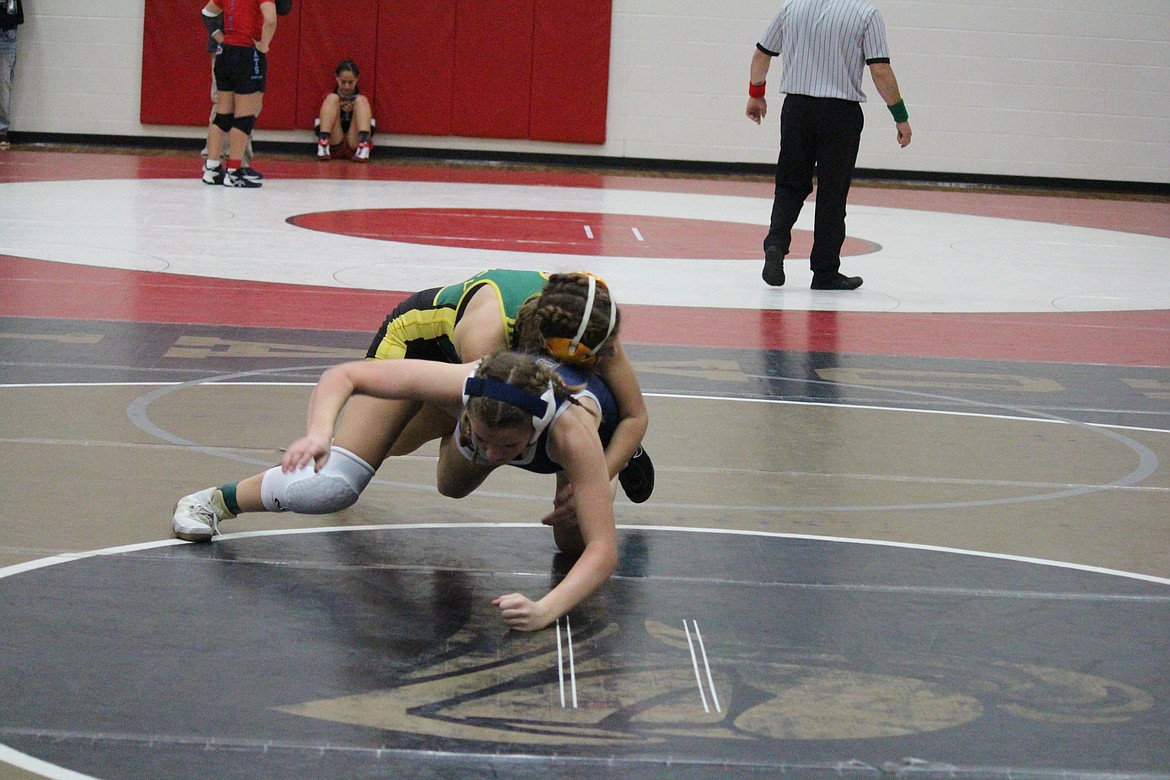 Quincy’s Jourdan Ferguson wrestles against Glacier Peak’s Ava Thomas at last weekend’s Othello Lady Huskie Invite. This weekend, Quincy girls wrestling is hosting its Bring Home Da Beef tournament.