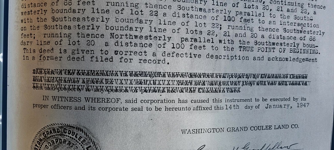 This 1947 deed for a property in Electric City has the racial restrictions crossed out.  (Note: The original image contained white text on a black background. It has been modified for legibility.)