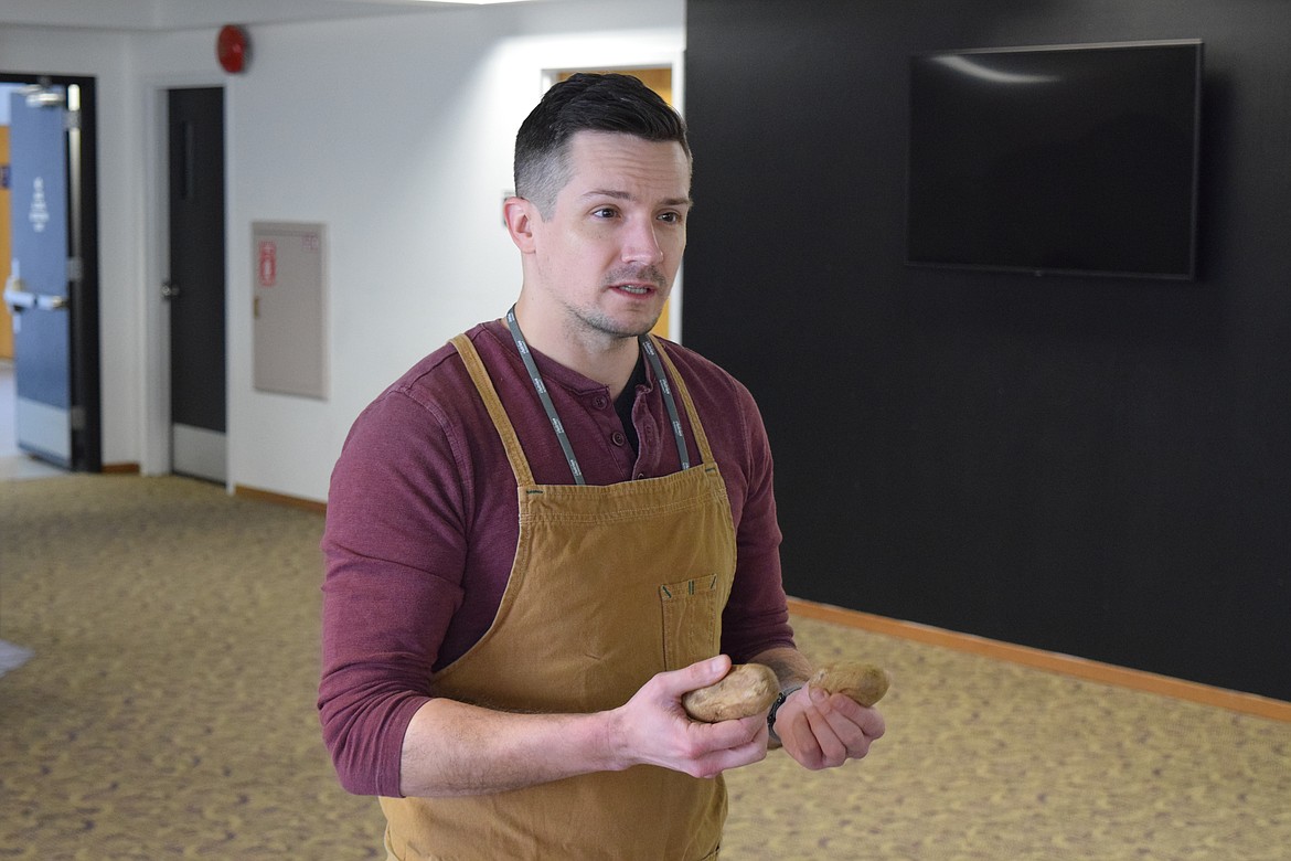 Seattle-based professional Chef Ben Leonard shows off some of the potatoes he is going to use to make gnocchi — Italian potato dumplings.