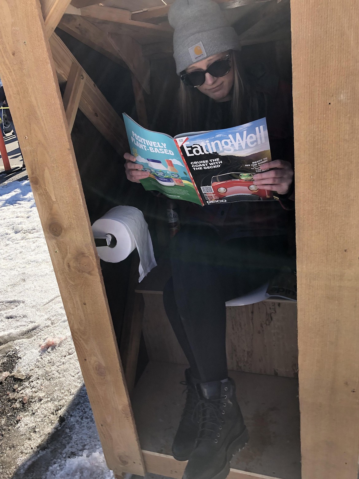 Participants will enjoy some time to sit down during Spirit Lake's Winterfest Outhouse Races on Maine Street this afternoon.
