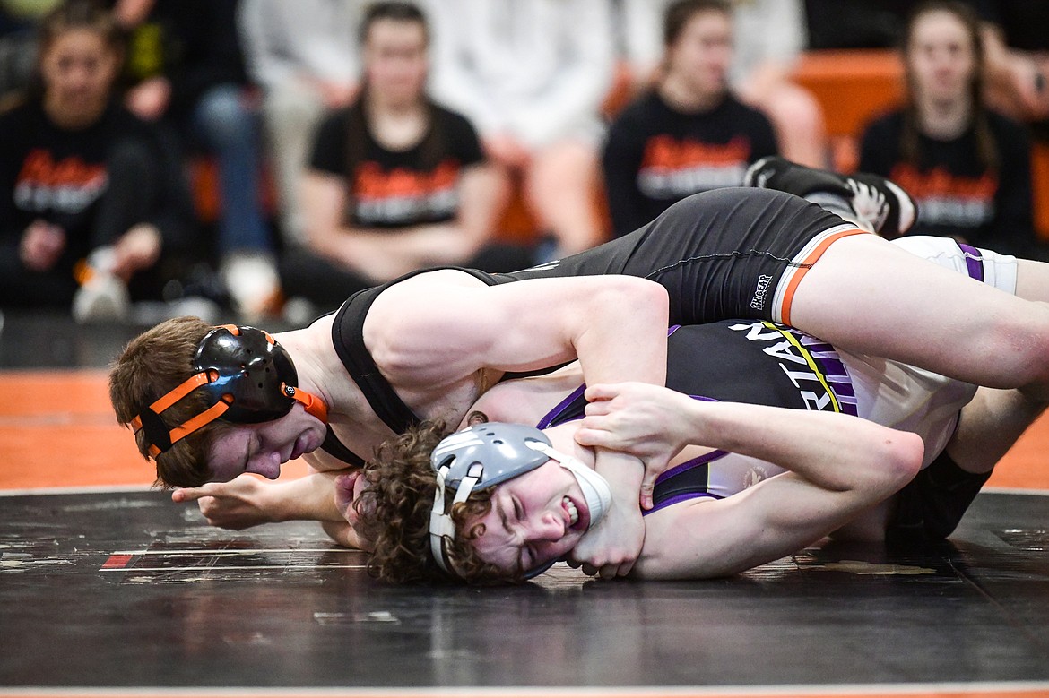 Flathead's Aiden Downing wrestles Missoula Sentinel's Darren Fuller at  126 pounds at Flathead High School on Saturday, Jan. 28. Downing won by pin. (Casey Kreider/Daily Inter Lake)