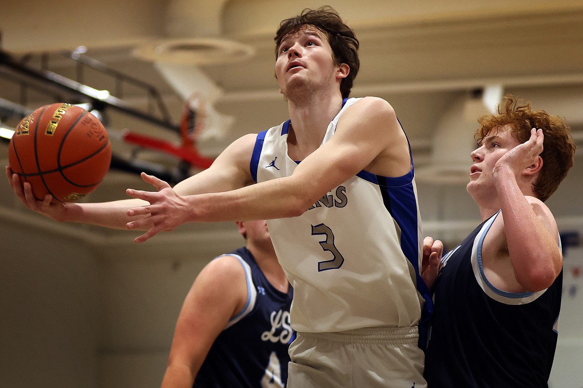 Bigfork's Isak Epperly goes to the basket for two of his 13-points against Loyola in Bigfork Saturday, Jan. 28. (Jeremy Weber/Daily Inter Lake)