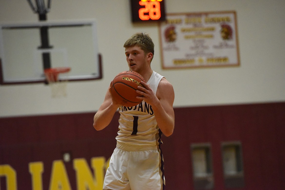 Troy's Trevor Grant scored 15 points against Plains in Saturday's game. (Scott Shindledecker/The Western News)