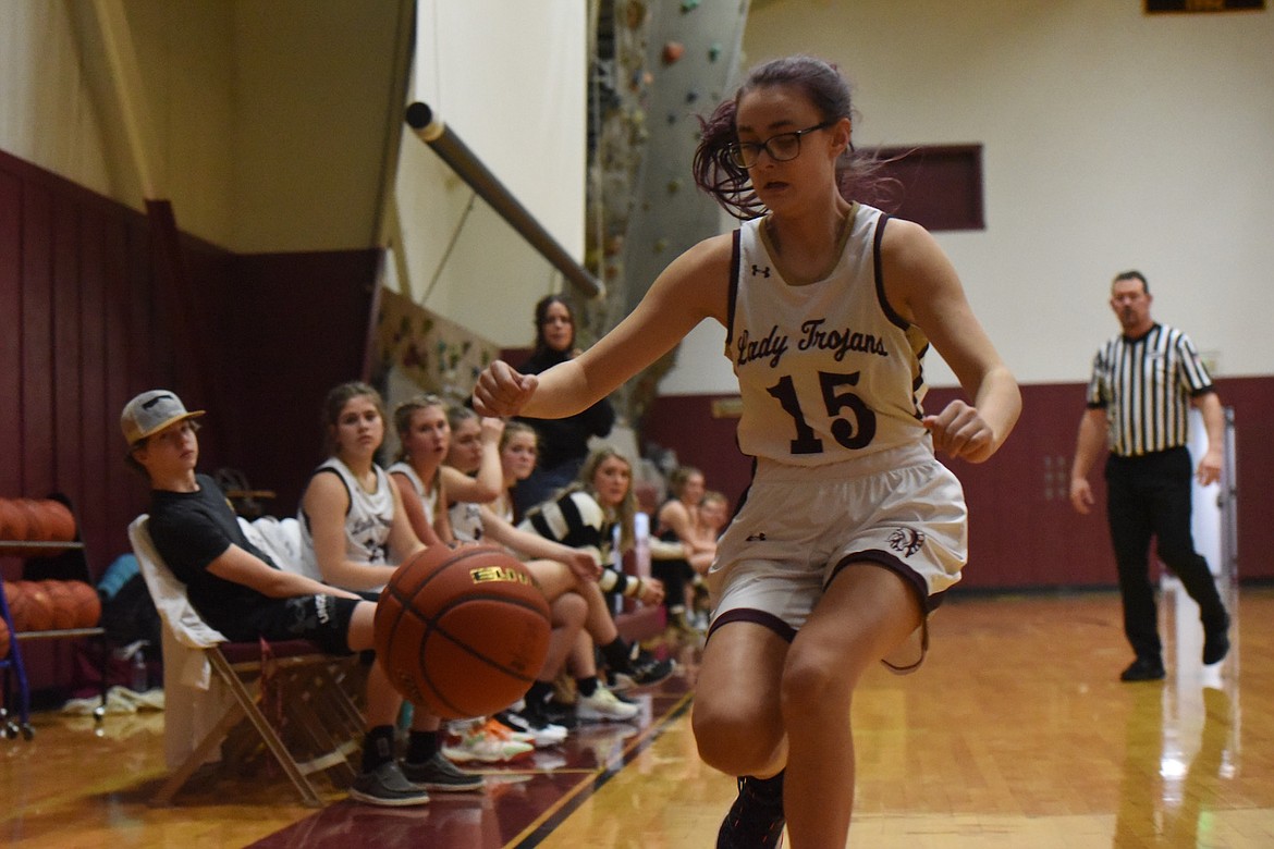 Troy's Halle Wallace hustles after a loose ball against Plains in Saturday's game. (Scott Shindledecker/The Western News)