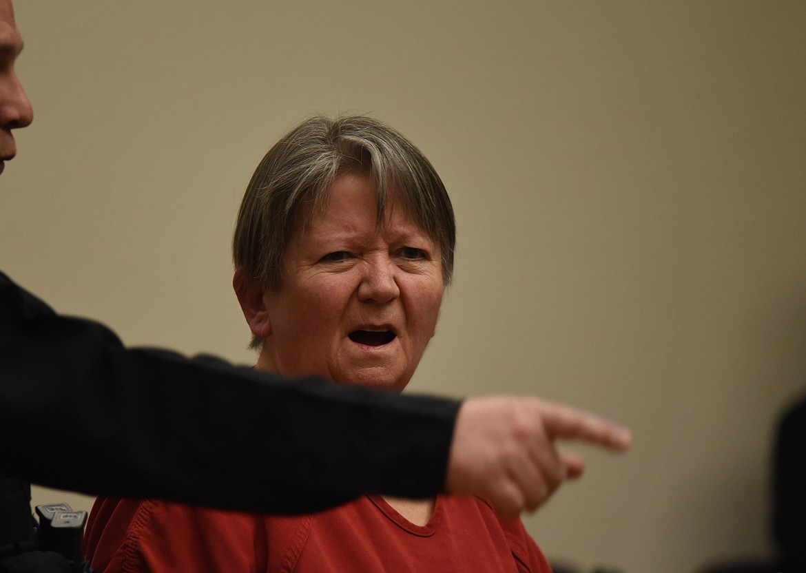 Kay Lynn Johnson, 64, is lead away by Flathead County Detention Center officers after her Jan. 25 sentencing. (Derrick Perkins/Daily Inter Lake)