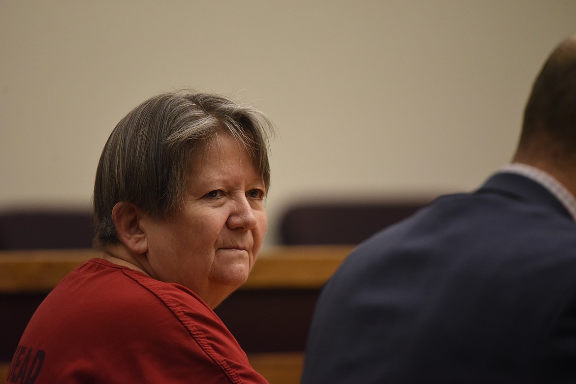 Kay Lynn Johnson sits at the defendants table with her defense attorney at her Jan. 25 sentencing in Flathead County District Court. (Derrick Perkins/Daily Inter Lake)