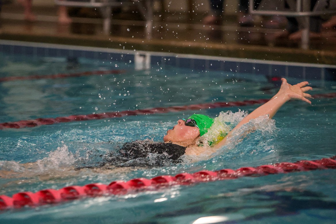 Emi Qunel does the backstroke at the Wave in the Columbia Falls duel on Friday. (JP Edge/Hungry Horse News)